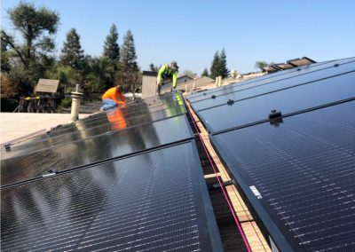 technicians installing solar panels in bakersfield california