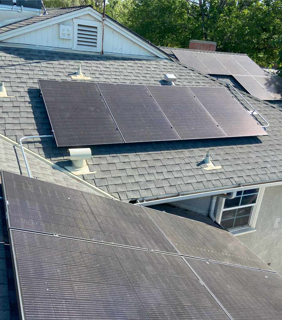 A rooftop solar panel installation on a residential home, showcasing multiple high-efficiency panels mounted on a shingle roof. This system highlights clean energy solutions for homeowners in Bakersfield, Kern County, San Luis Obispo County, and across Central California, designed to maximize energy savings and long-term performance.